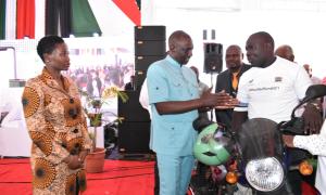 H.E interacting with a beneficiary.